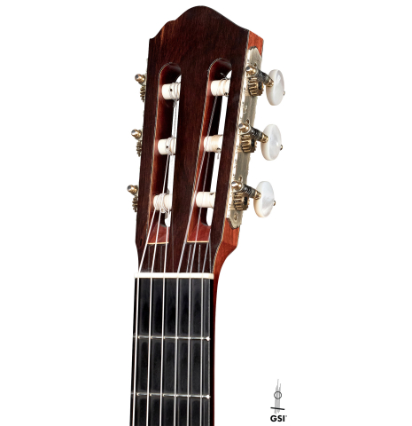 This is the headstock of a 1986 Cynthia H. Burton SP/MH classical guitar on a white background