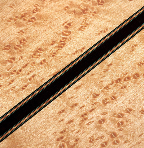 A close-up of the back of a 2012 Geza Burghardt &quot;1943 Hauser&quot; classical guitar made with spruce and maple.