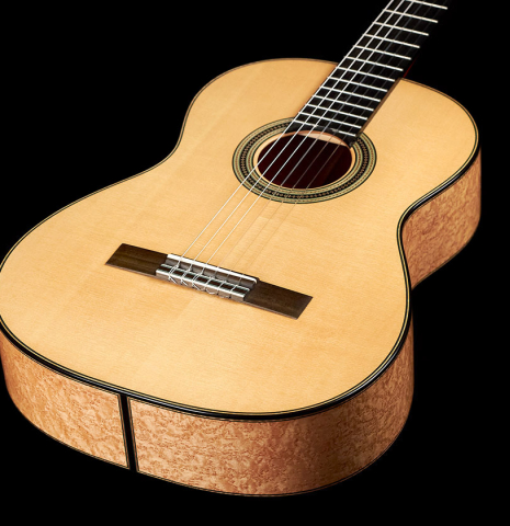 The front of a 2012 Geza Burghardt &quot;1943 Hauser&quot; classical guitar made with spruce and maple.