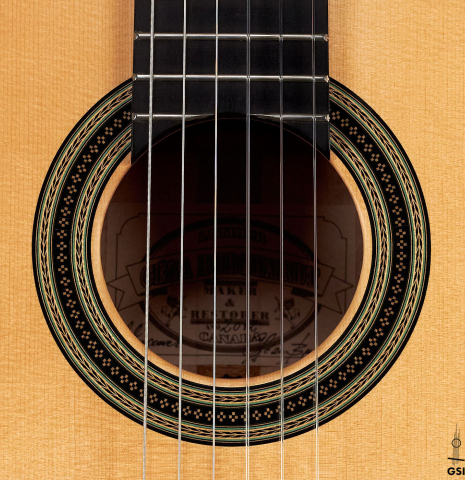 The rosette of a 2012 Geza Burghardt &quot;1943 Hauser&quot; classical guitar made with spruce and maple.