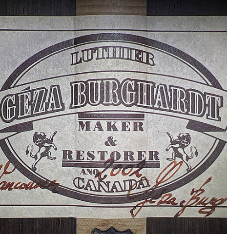 The label of a 2002 Geza Burghardt "Grand Concert - dedicated to JL Romanillos" classical guitar made of spruce and CSA rosewood