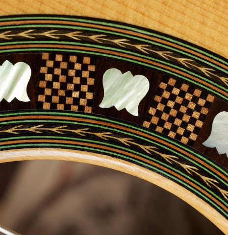 Closeup detail of the rosette of a 2002 Geza Burghardt "Grand Concert - dedicated to JL Romanillos" classical guitar made of spruce and CSA rosewood