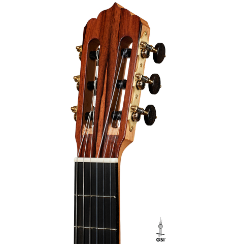 The headstock of a 2025 Carlos Juan Busquiel classical guitar made with cedar and African rosewood