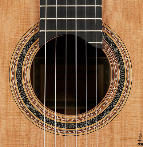 The rosette of a 2025 Carlos Juan Busquiel classical guitar made with cedar and African rosewood