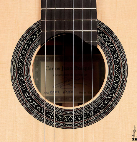The rosette of a 2022 Carlos Juan Busquiel classical guitar made with spruce and CSA rosewood