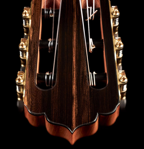 The headstock of a 2023 Carlos Juan Busquiel classical guitar made with spruce and CSA rosewood.