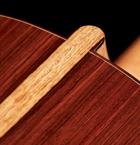 Closeup of the heel and back of a 2023 Carlos Juan Busquiel classical guitar made with spruce and CSA rosewood.