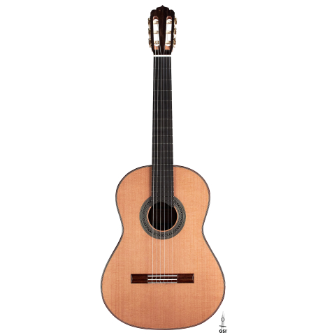 The front of a 2023 Carlos Juan Busquiel classical guitar made with cedar and CSA rosewood shown on a white background