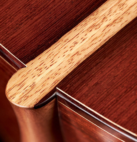 The heel of a 2023 Carlos Juan Busquiel classical guitar made with cedar and CSA rosewood.