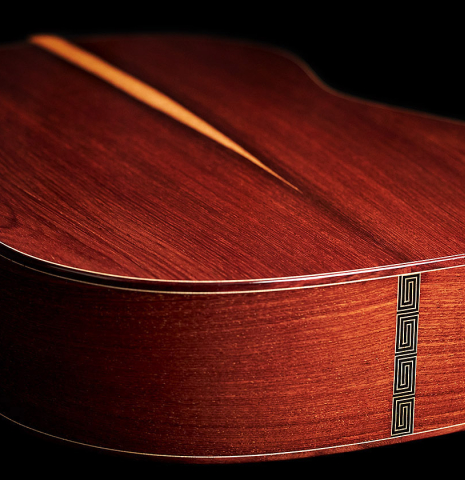 The back, binding and sides of a 2023 Carlos Juan Busquiel classical guitar made with cedar and CSA rosewood.