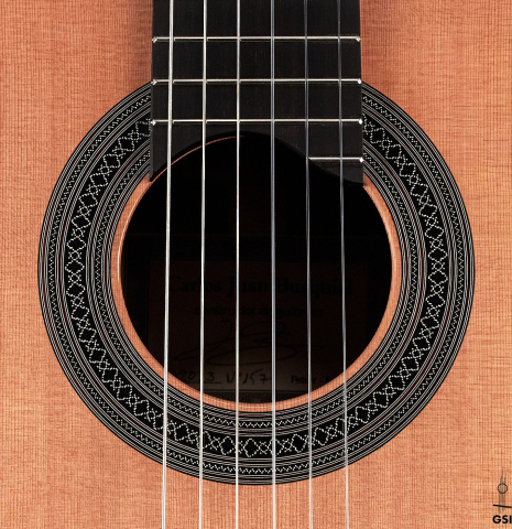 The rosette of a 2023 Carlos Juan Busquiel classical guitar made with cedar and CSA rosewood