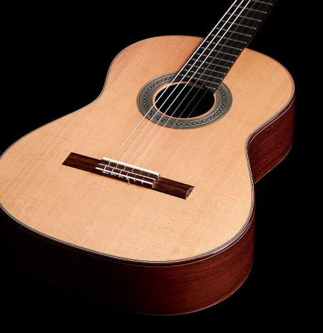 The front of a 2023 Carlos Juan Busquiel classical guitar made with cedar and CSA rosewood.