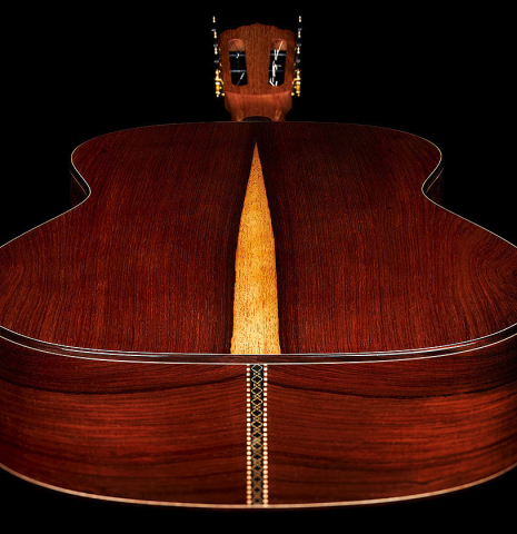 The back and sides at the foot of a 2024 Carlos Juan Busquiel classical guitar made with cedar and CSA rosewood