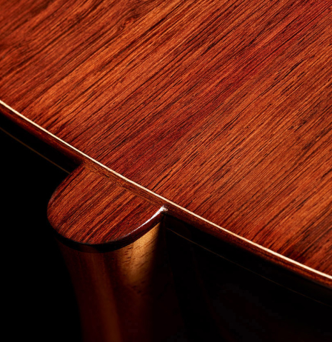The heel, back binding and purflings of a 2024 Carlos Juan Busquiel classical guitar made with spruce and African rosewood