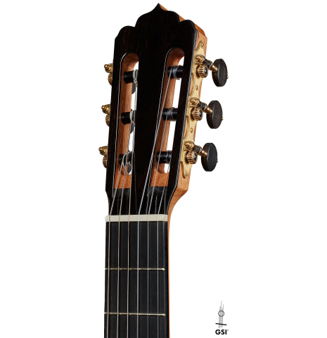 The headstock of a 2024 Carlos Juan Busquiel classical guitar made with spruce and African rosewood