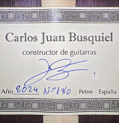 The label of a 2024 Carlos Juan Busquiel classical guitar made with spruce and African rosewood