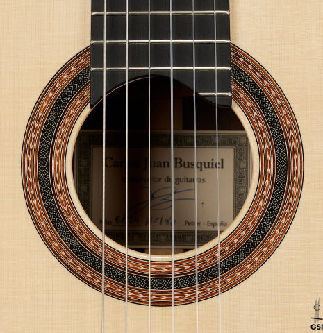 The rosette of a 2024 Carlos Juan Busquiel classical guitar made with spruce and African rosewood
