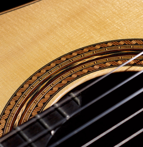 The rosette of a 2005 Gregory Byers classical guitar made with spruce and CSA rosewood