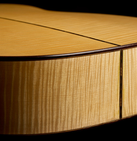 The sides at the foot of a 2011 Gregory Byers "630 Lattice" classical guitar made of spruce and maple