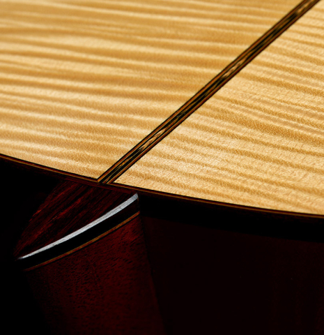 The heel, back binding and purfling of a 2011 Gregory Byers "630 Lattice" classical guitar made of spruce and maple