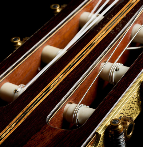 The headstock veneer with inlay and tuning machines of a 2011 Gregory Byers "630 Lattice" classical guitar made of spruce and maple