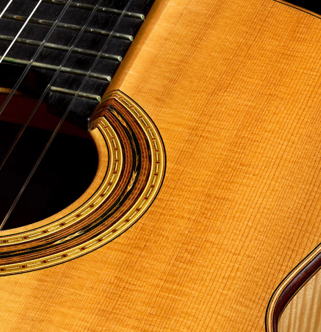 The soundboard and rosette of a 2011 Gregory Byers "630 Lattice" classical guitar made of spruce and maple