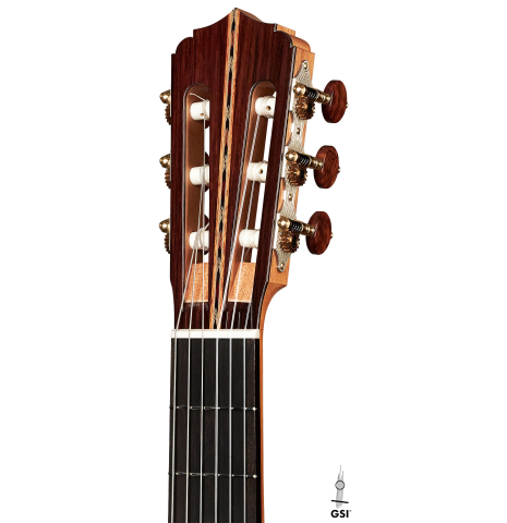 The headstock of a 2022 Michael Cadiz "Torres/Romanillos" classical guitar made with spruce and African rosewood.