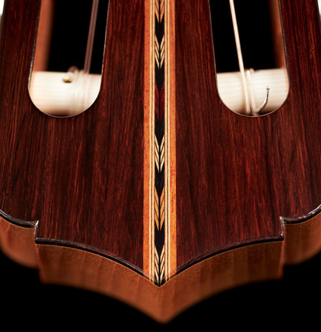 The headstock of a 2022 Michael Cadiz "Torres/Romanillos" classical guitar made with spruce and African rosewood.