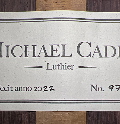 The label of a 2022 Michael Cadiz "Torres/Romanillos" classical guitar made with spruce and African rosewood.