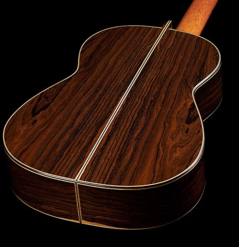 The back and sides of a 2019 Michael Cadiz classical guitar made of spruce and ziricote