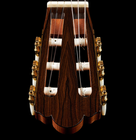The headstock and tuning machines of a 2019 Michael Cadiz classical guitar made of spruce and ziricote