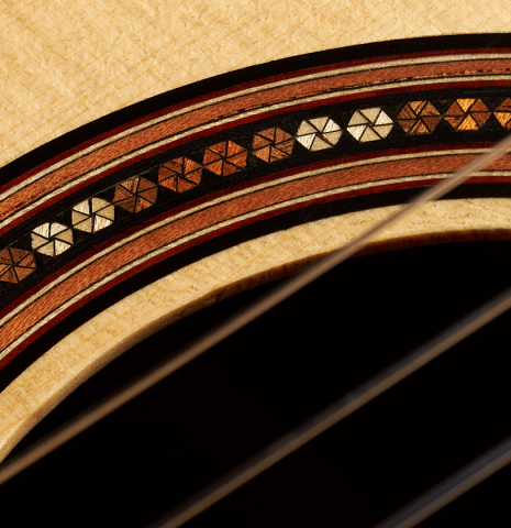 Detail of the rosette of a 2019 Michael Cadiz classical guitar made of spruce and ziricote