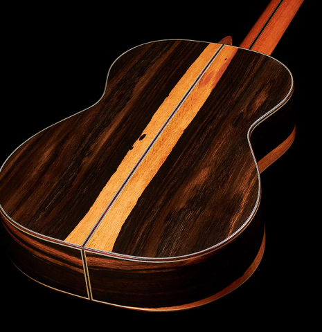The back and sides at the foot of a 2023 Hermanos Camps "CL20-S" classical guitar made of spruce and exotic ebony