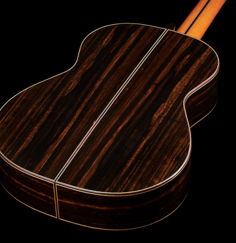 The back and sides at the foot of a 2024 Hermanos Camps "CL20-S" classical guitar made of spruce and exotic ebony