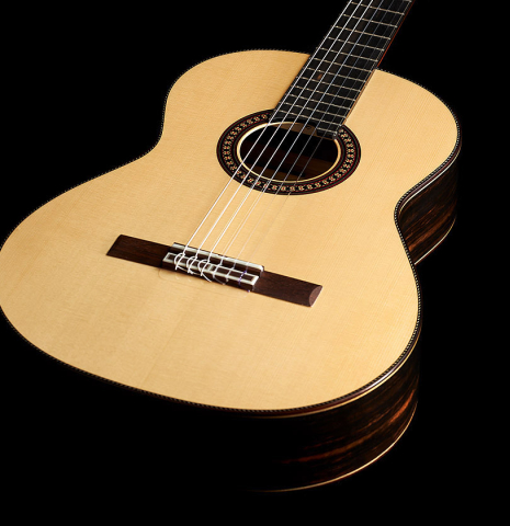 The top of a 2024 Hermanos Camps "CL20-S" classical guitar made of spruce and exotic ebony