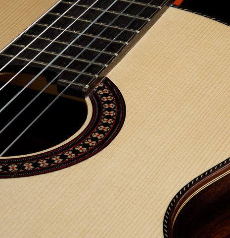 The soundboard of a 2025 Hermanos Camps "CL20-S" classical guitar made of spruce and exotic ebony