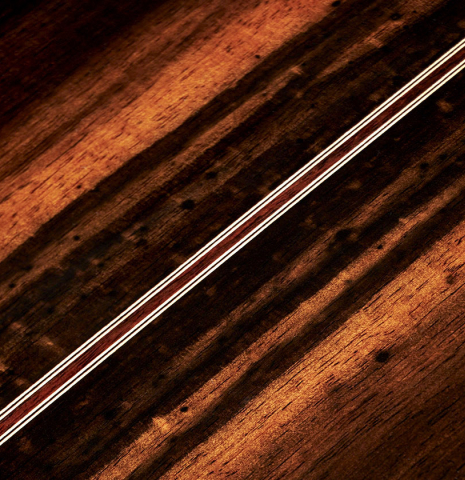The back of a 2023 Hermanos Camps "CL20-C" classical guitar made of cedar and exotic ebony.