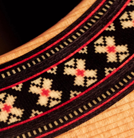 The rosette of a 2023 Hermanos Camps "CL20-C" classical guitar made of cedar and exotic ebony.