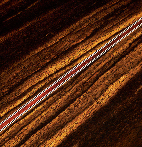 The back center seam of a 2023 Hermanos Camps "CL20-C" classical guitar made of cedar and exotic ebony