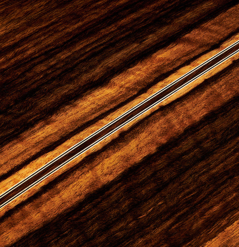 The back center seam of a 2024 Hermanos Camps "CL20-C" classical guitar made of cedar and exotic ebony