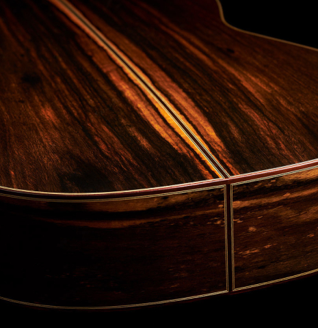 The back and sides at the foot of a 2024 Hermanos Camps "CL20-C" classical guitar made of cedar and exotic ebony