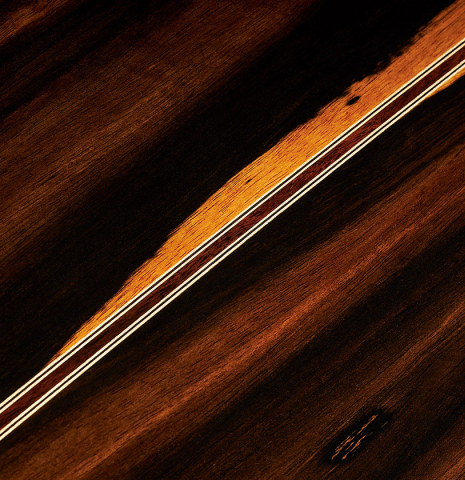 The back center seam of a 2024 Hermanos Camps "CL20-C" classical guitar made of cedar and exotic ebony