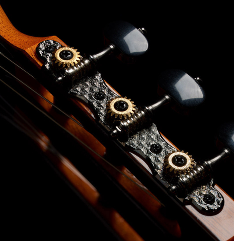 The headstock and tuning machines of a 2024 Hermanos Camps "CL20-C" classical guitar made of cedar and exotic ebony