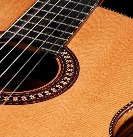 The soundboard and rosette of a 2024 Hermanos Camps "CL20-C" classical guitar made of cedar and exotic ebony