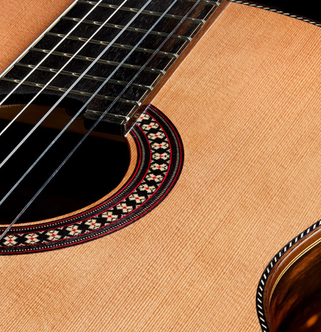 The soundboard of a 2025 Hermanos Camps "CL20-C" classical guitar made of cedar and exotic ebony