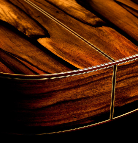 The back and sides at the foot of a 2026 Hermanos Camps "CL20-C" classical guitar made of cedar and exotic ebony
