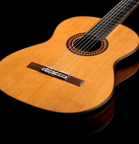 The soundboard of a 2026 Hermanos Camps "CL20-C" classical guitar made of cedar and exotic ebony