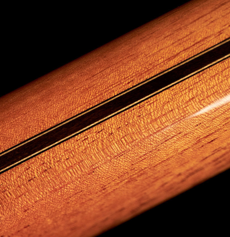 The neck of a 2023 Hermanos Camps "GL18C" classical guitar made with cedar and Indian rosewood.