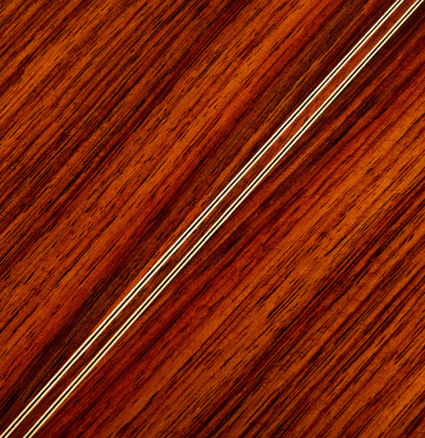 The back center seam of a Hermanos Camps "CL18C" classical guitar made of cedar and Indian rosewood