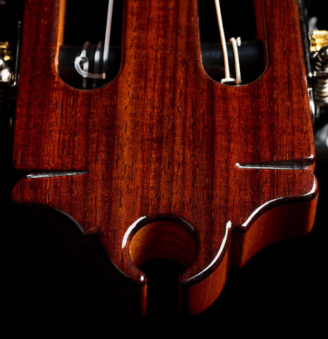 The headstock veneer and tuning machines of a Hermanos Camps "CL18C" classical guitar made of cedar and Indian rosewood